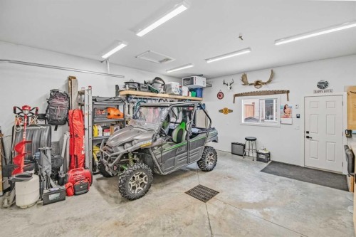 52 Iron Gate Boulevard, Sylvan Lake, AB - Indoor Photo Showing Garage