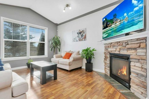 95 Jepsen Crescent, Red Deer, AB - Indoor Photo Showing Living Room With Fireplace