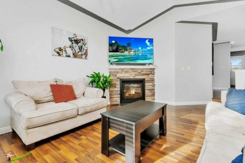 95 Jepsen Crescent, Red Deer, AB - Indoor Photo Showing Living Room With Fireplace
