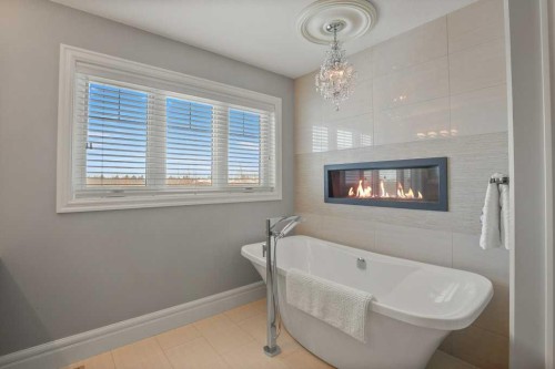 24 Sawyer Close, Red Deer, AB - Indoor Photo Showing Bathroom With Fireplace
