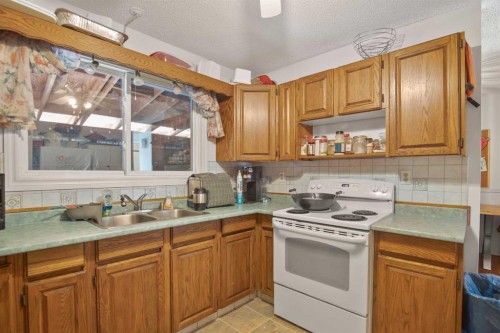 30 Greig Drive, Red Deer, AB - Indoor Photo Showing Kitchen With Double Sink