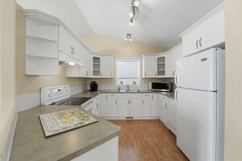 16 Lanterman Close, Red Deer, AB - Indoor Photo Showing Kitchen With Double Sink