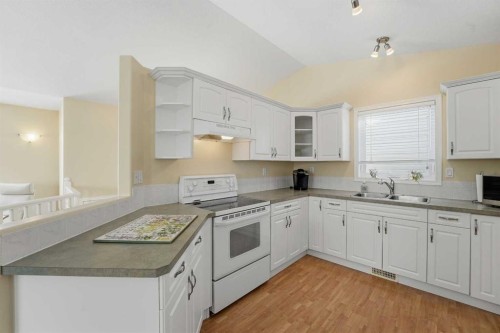 16 Lanterman Close, Red Deer, AB - Indoor Photo Showing Kitchen With Double Sink
