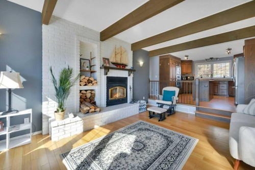 5317 50 Street, Bentley, AB - Indoor Photo Showing Living Room With Fireplace