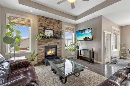 94 Mackenzie Crescent, Lacombe, AB - Indoor Photo Showing Living Room With Fireplace