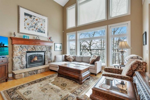 57-39408 Range Road 21, Rural Lacombe County, AB - Indoor Photo Showing Living Room With Fireplace