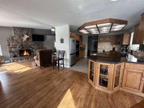 19438 Twp Rd 430, Rural Camrose County, AB - Indoor Photo Showing Kitchen With Fireplace
