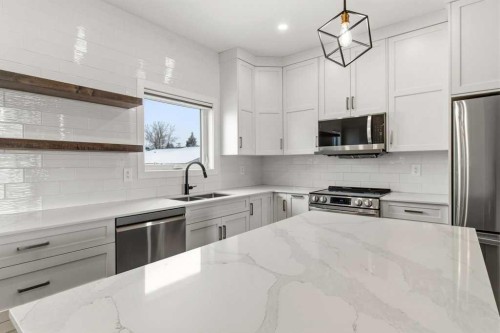 4307 48 Avenue, Sylvan Lake, AB - Indoor Photo Showing Kitchen With Double Sink With Upgraded Kitchen