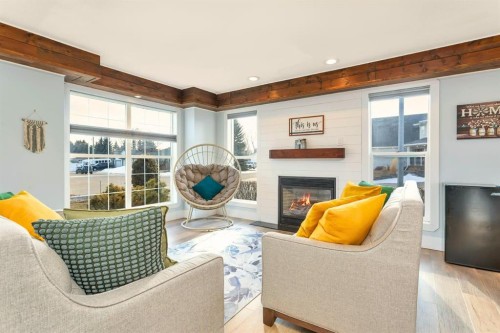 85 Hathaway Lane, Lacombe, AB - Indoor Photo Showing Living Room With Fireplace