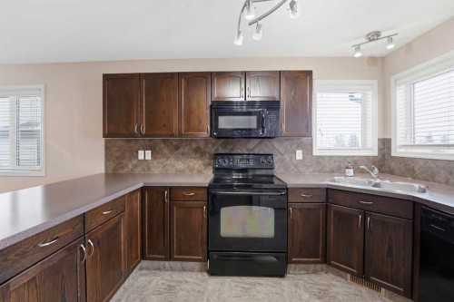 28 Ibbotson Close, Red Deer, AB - Indoor Photo Showing Kitchen With Double Sink