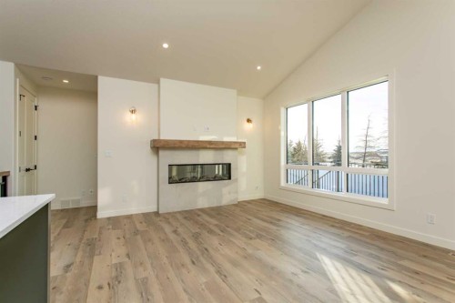 20 Emmett Crescent, Red Deer, AB - Indoor Photo Showing Living Room With Fireplace