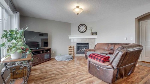 148 Valley Crescent, Blackfalds, AB - Indoor Photo Showing Living Room With Fireplace