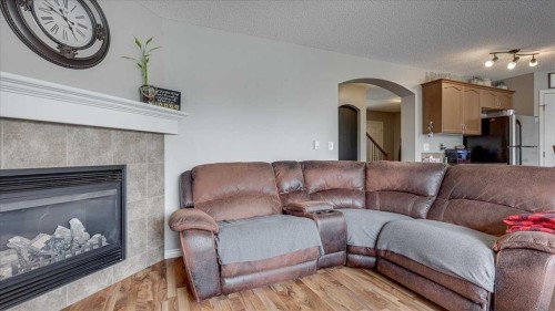 148 Valley Crescent, Blackfalds, AB - Indoor Photo Showing Living Room With Fireplace