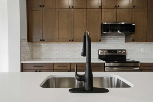 115 Crestview Boulevard, Sylvan Lake, AB - Indoor Photo Showing Kitchen With Double Sink