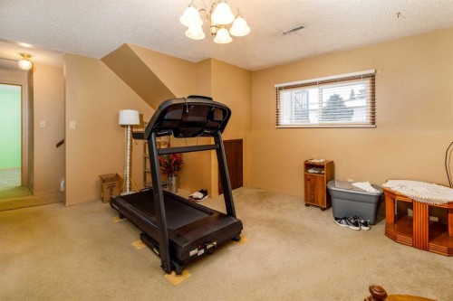 7 Mclevin Crescent, Red Deer, AB - Indoor Photo Showing Gym Room