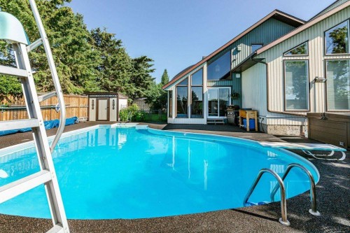 14 Warwick Drive, Red Deer, AB - Outdoor With In Ground Pool