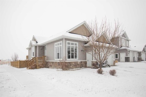 7135 Henner'S Road, Lacombe, AB - Outdoor With Facade