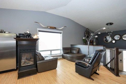 1 Ralston Place, Sylvan Lake, AB - Indoor Photo Showing Living Room With Fireplace