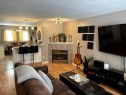 47-33 Donlevy Avenue, Red Deer, AB  - Indoor Photo Showing Living Room With Fireplace 