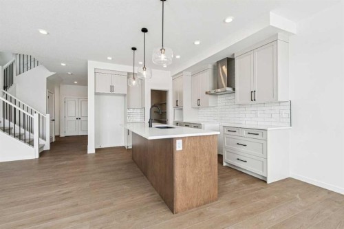 208 Southborough Common, Cochrane, AB - Indoor Photo Showing Kitchen With Upgraded Kitchen