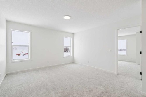 208 Southborough Common, Cochrane, AB - Indoor Photo Showing Other Room