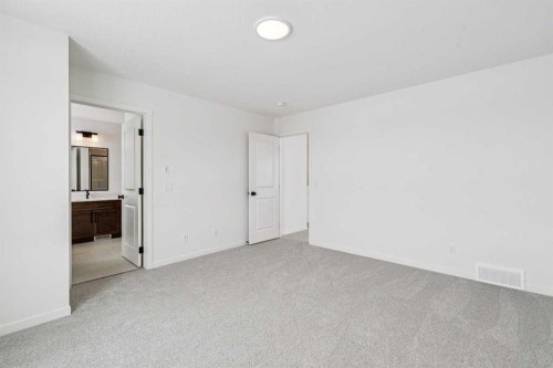 208 Southborough Common, Cochrane, AB - Indoor Photo Showing Other Room