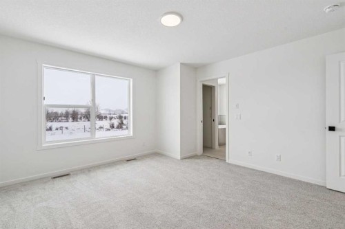 208 Southborough Common, Cochrane, AB - Indoor Photo Showing Other Room