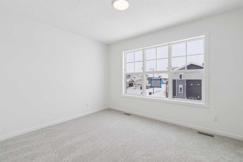 208 Southborough Common, Cochrane, AB - Indoor Photo Showing Other Room