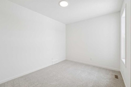 208 Southborough Common, Cochrane, AB - Indoor Photo Showing Other Room