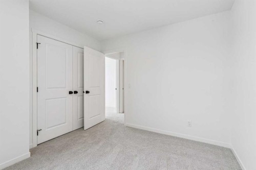 208 Southborough Common, Cochrane, AB - Indoor Photo Showing Other Room