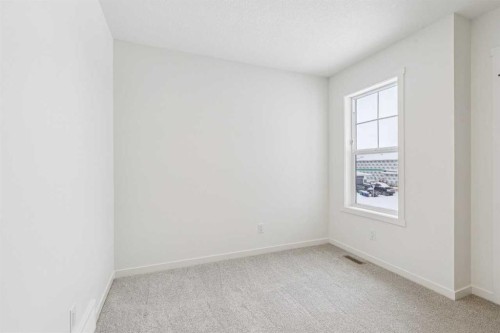 208 Southborough Common, Cochrane, AB - Indoor Photo Showing Other Room