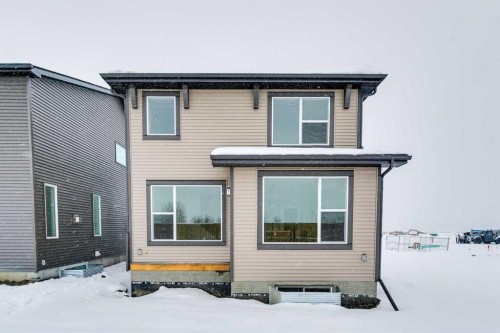 208 Southborough Common, Cochrane, AB - Outdoor With Exterior