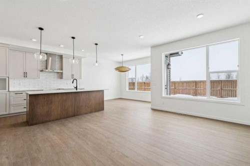 208 Southborough Common, Cochrane, AB - Indoor Photo Showing Kitchen With Upgraded Kitchen
