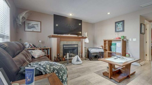 143 Ackerman Crescent, Red Deer, AB - Indoor Photo Showing Living Room With Fireplace