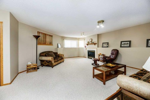 135 Doran Crescent, Red Deer, AB - Indoor With Fireplace