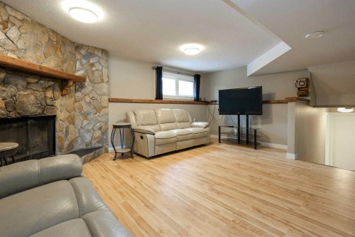 415 Barrett Drive, Red Deer, AB - Indoor Photo Showing Living Room With Fireplace