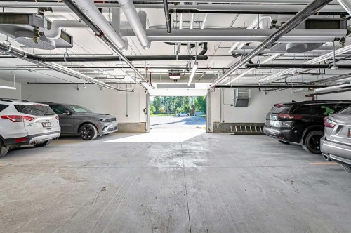 302-97 Station Drive, Sylvan Lake, AB - Indoor Photo Showing Garage