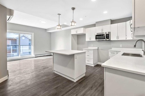 302-97 Station Drive, Sylvan Lake, AB - Indoor Photo Showing Kitchen With Double Sink With Upgraded Kitchen