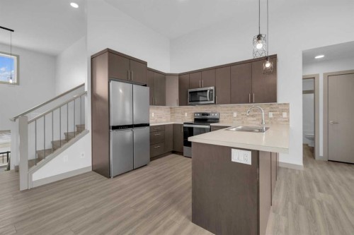 13 Vanson Close, Sylvan Lake, AB - Indoor Photo Showing Kitchen With Upgraded Kitchen