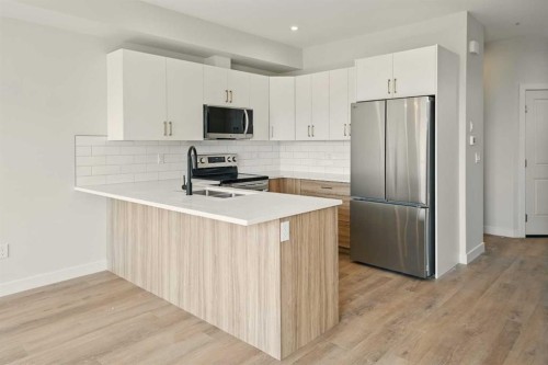 69 Pinnacle Close, Blackfalds, AB - Indoor Photo Showing Kitchen