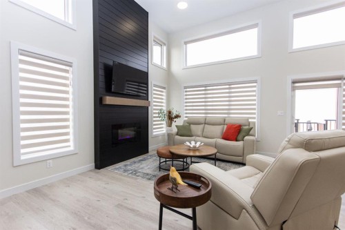 224 Emerald Drive, Red Deer, AB - Indoor Photo Showing Living Room With Fireplace