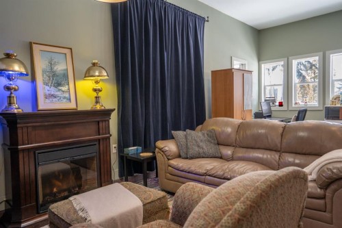 5223 Newson Boulevard, Bashaw, AB - Indoor Photo Showing Living Room With Fireplace