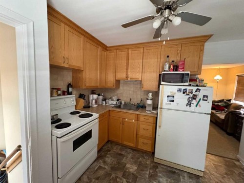 201 A&B First Street, Morrin, AB - Indoor Photo Showing Kitchen With Double Sink