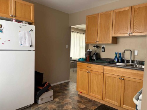 201 A&B First Street, Morrin, AB - Indoor Photo Showing Kitchen With Double Sink