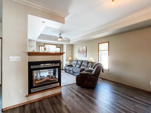 6701 41 Avenue, Stettler, AB - Indoor Photo Showing Living Room With Fireplace