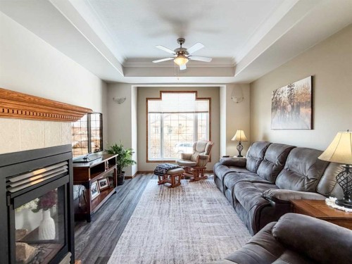6701 41 Avenue, Stettler, AB - Indoor Photo Showing Living Room With Fireplace