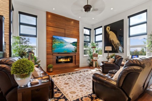 57 Lazaro Close, Red Deer, AB - Indoor Photo Showing Living Room With Fireplace