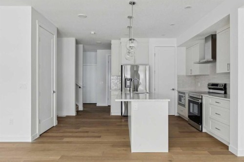 25 Linden Place, Rural Red Deer County, AB - Indoor Photo Showing Kitchen With Upgraded Kitchen