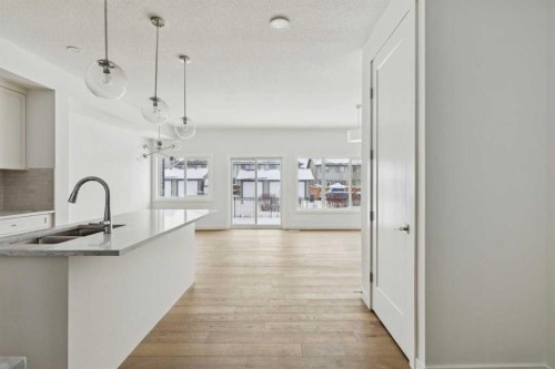 25 Linden Place, Rural Red Deer County, AB - Indoor Photo Showing Kitchen With Double Sink