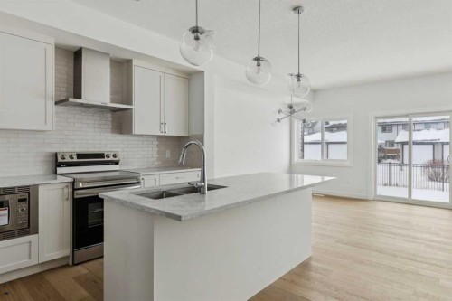 25 Linden Place, Rural Red Deer County, AB - Indoor Photo Showing Kitchen With Upgraded Kitchen